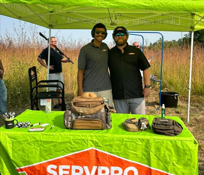 employees in tent at an event